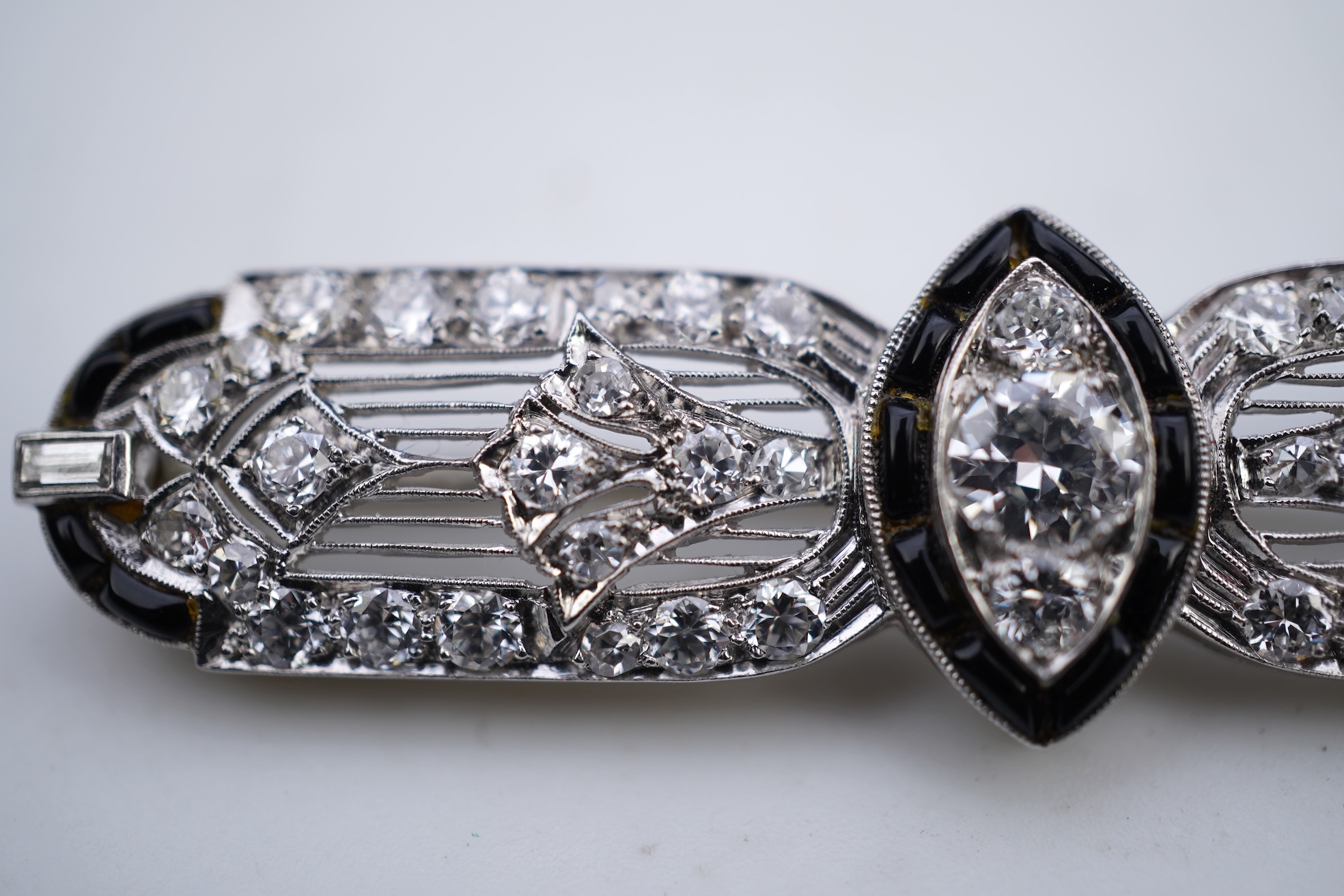 An Art Deco onyx and diamond brooch, 1920s